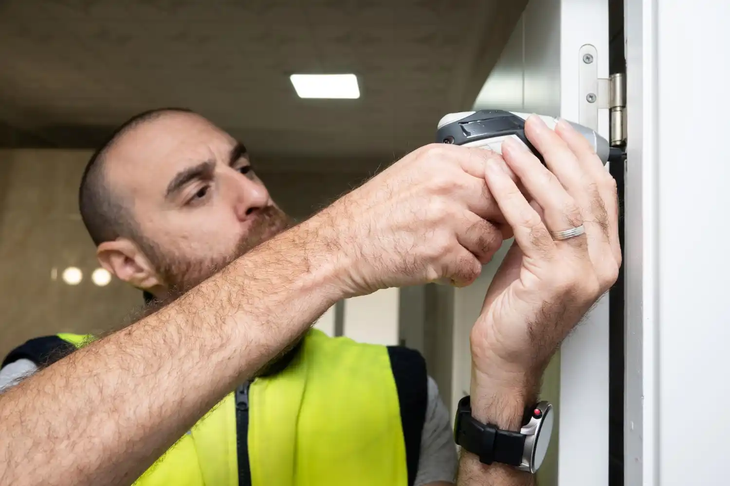 Emergency locksmith opening a house door in Borehamwood