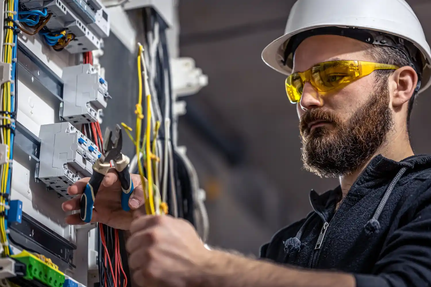 Emergency electrician repairing electrical fault in property